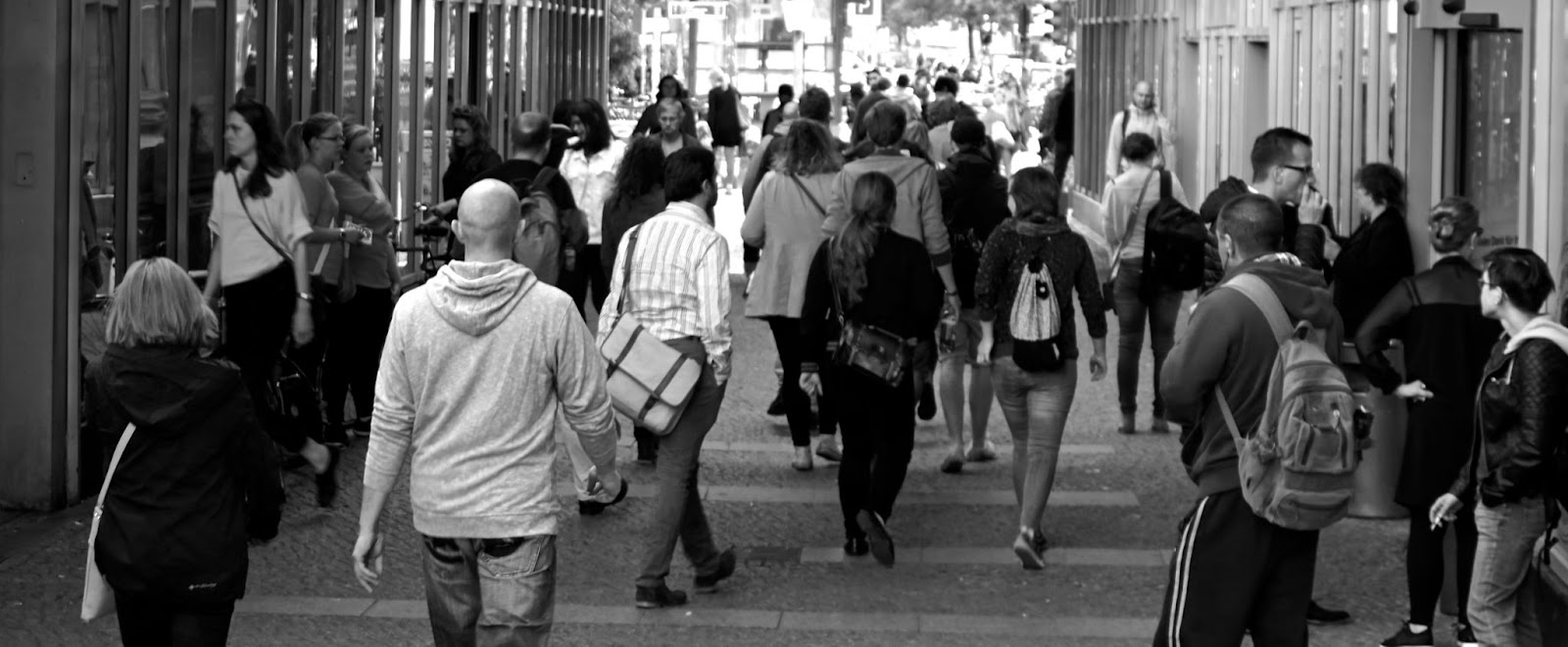 crowd of people walking on a street