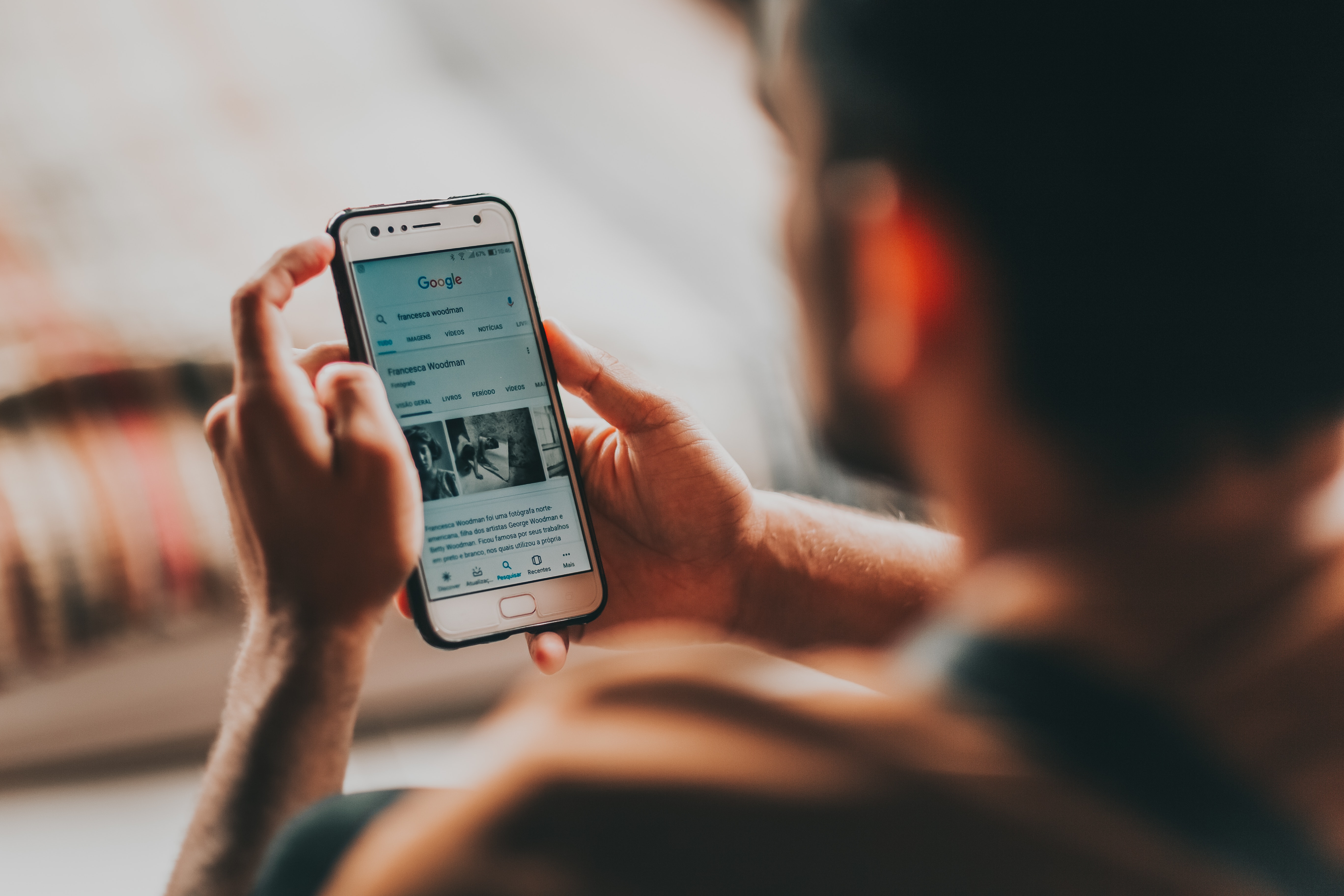 a man searching for information on his phone